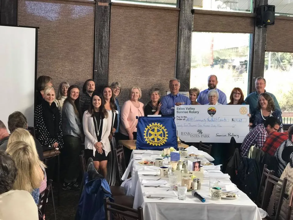Estes Valley Sunrise Rotary Club Estes Valley Sunrise Rotary Club giving a check away